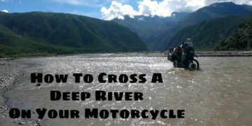 crossing a deep river on motorcycle