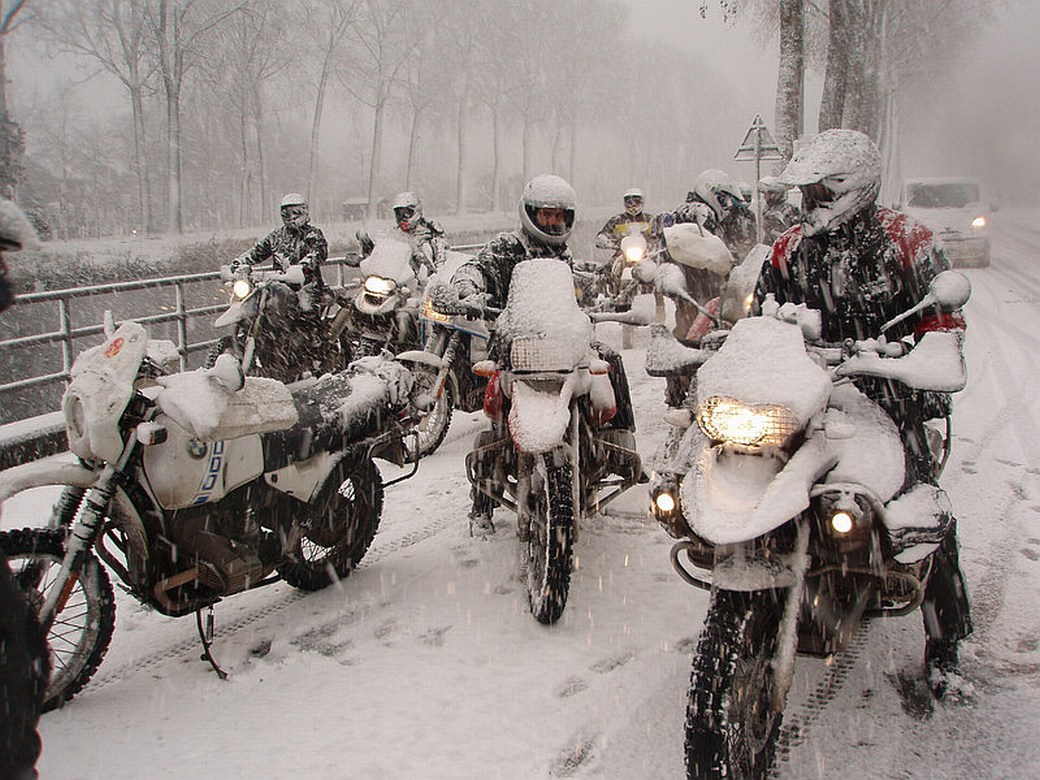 motorcycles on street in snow storm